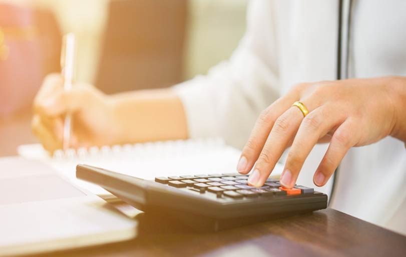 Woman working calculator - Unpaid Wages